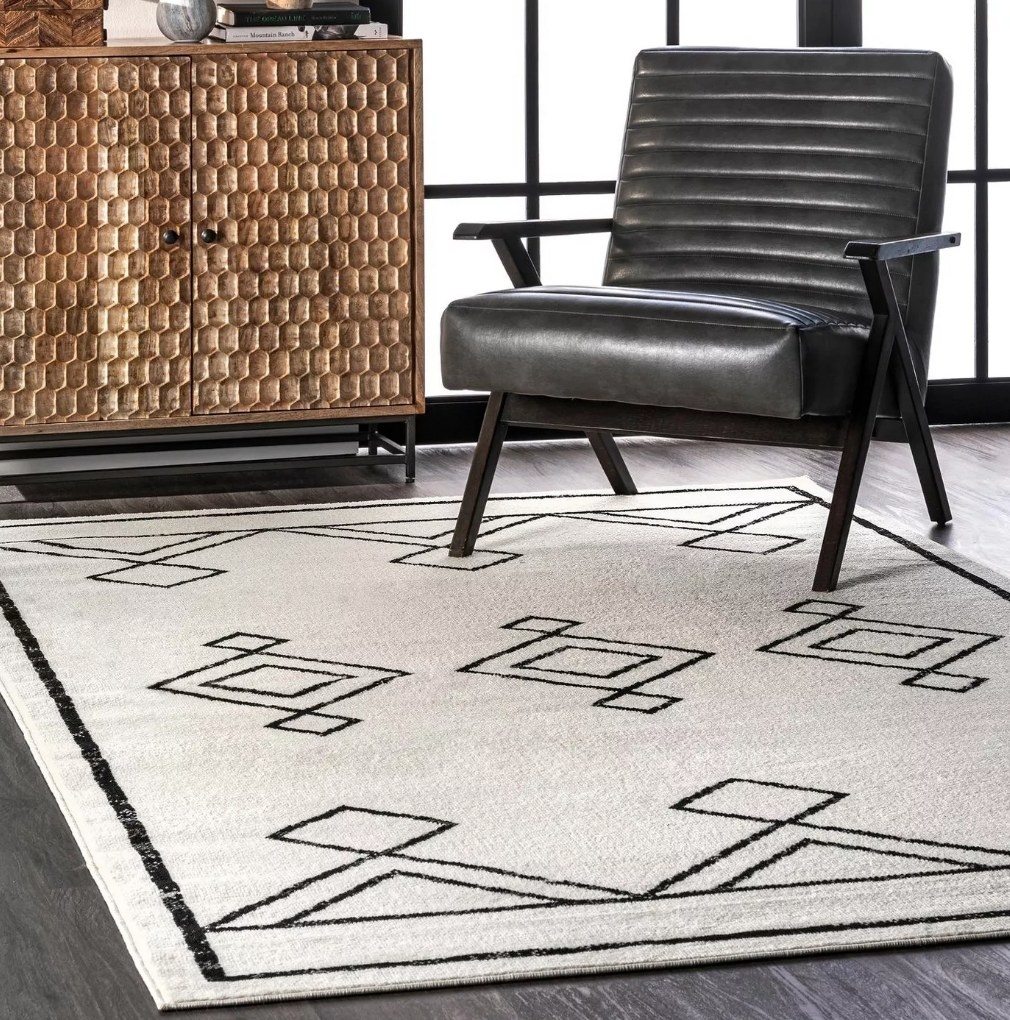 A black/beige, diamond geographic modern area rug