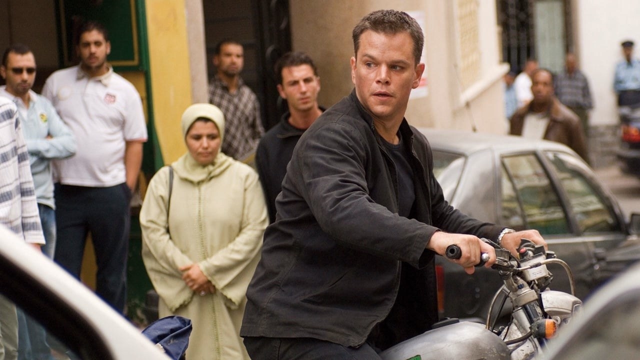 Matt Damon as Jason Bourne sitting on a motorcycle