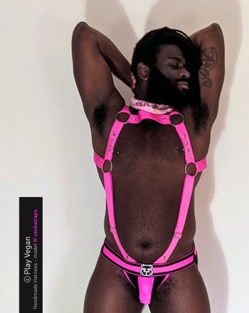 Model wearing pink full body harness