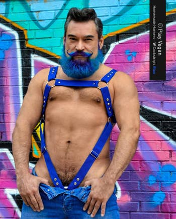 Model wearing blue full body harness