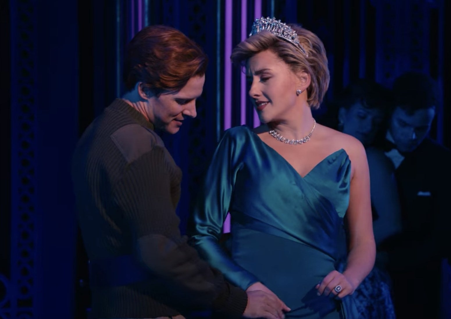 Gareth Keegan as James Hewitt dances with Jeanna de Waal as Princess Diana in a blue asymmetrical dress and tiara.