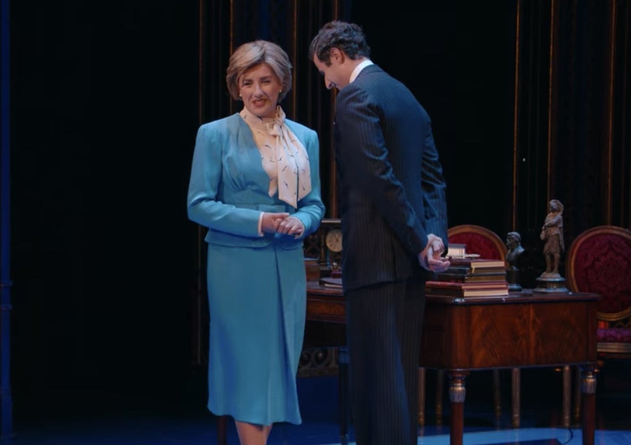 Jeanna de Waal as Princess Diana in a blue dress suit and Roe Hartrampf as Prince Charles.