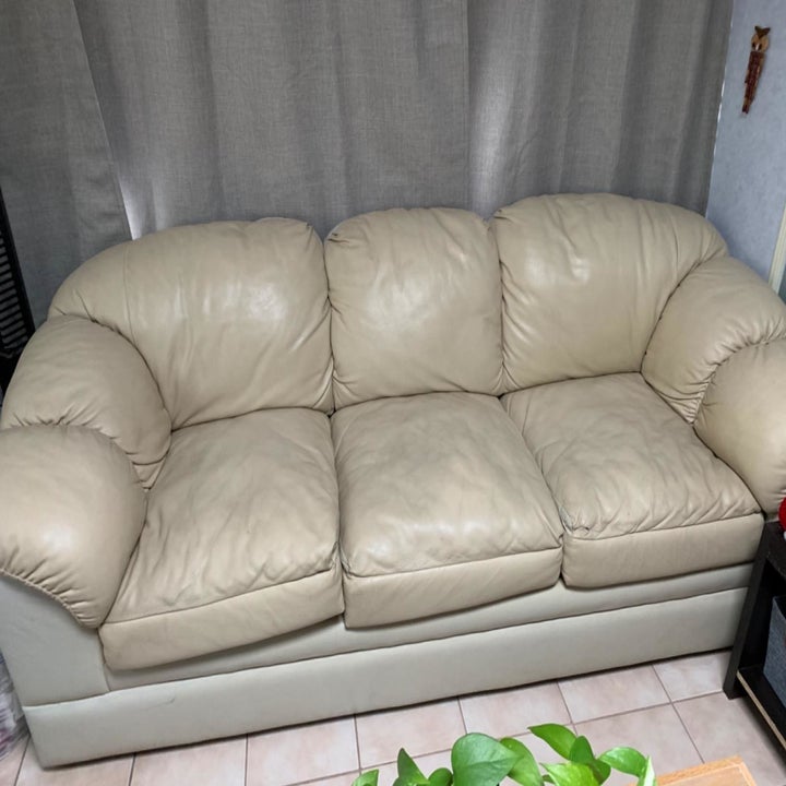 reviewer image of stained beige leather couch