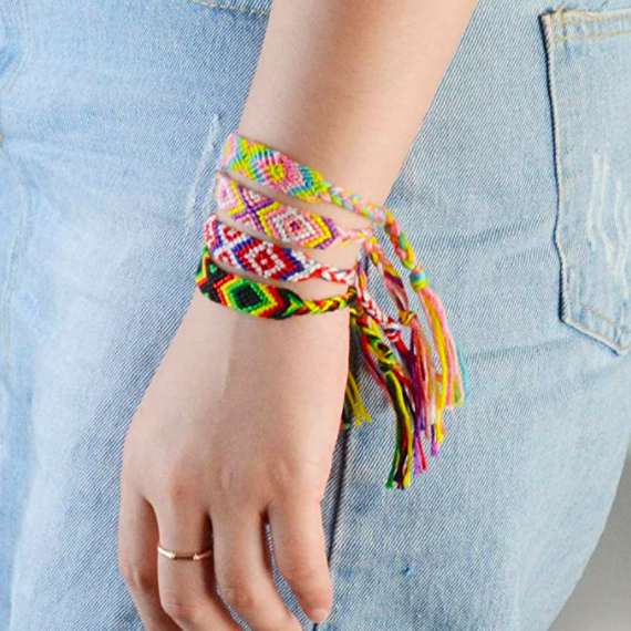 someone wearing the woven bracelets around their wrist