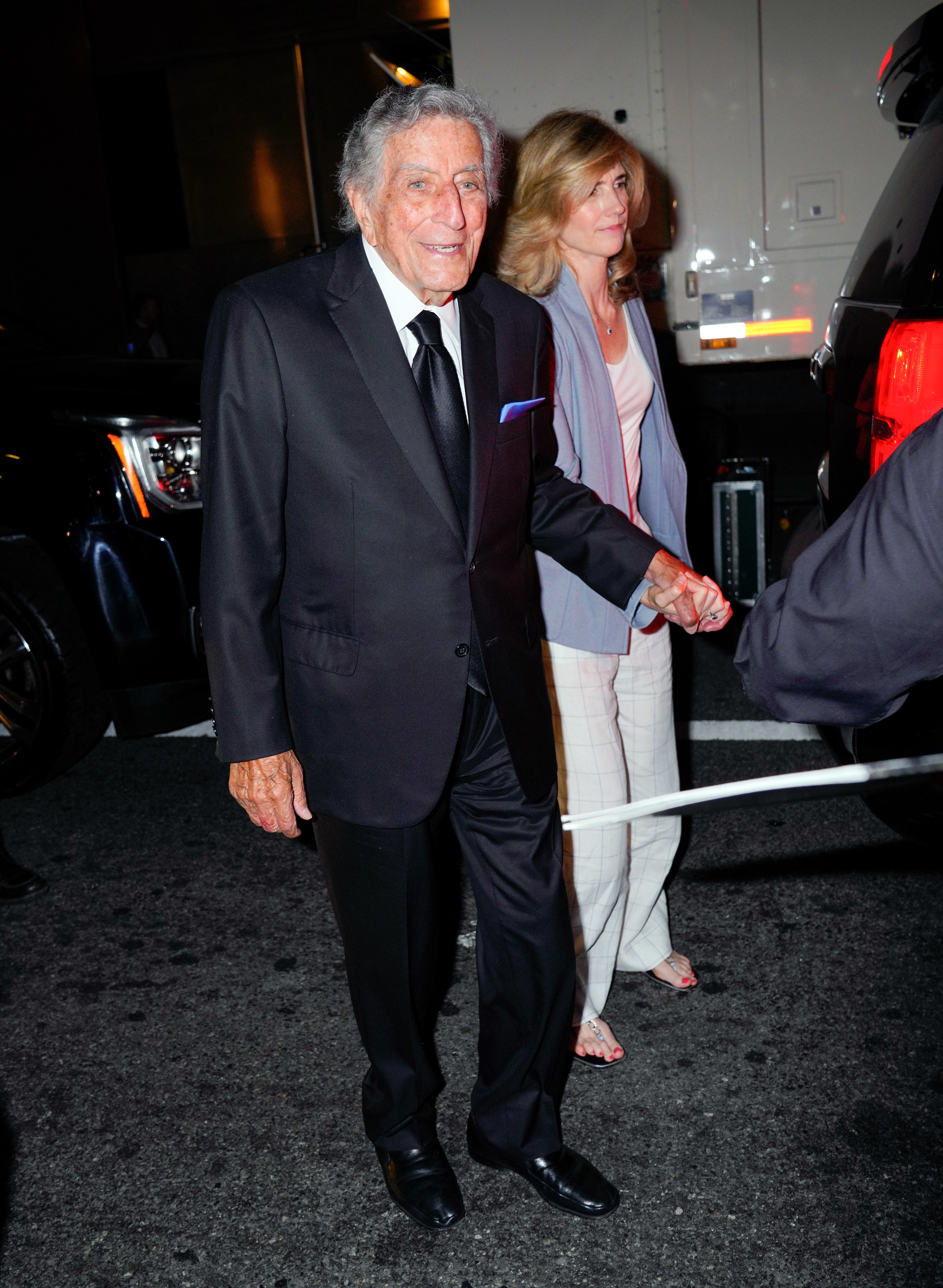 Tony walking hand-in-hand with his wife Susan