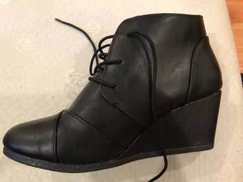a reviewer photo of the wedge bootie in black