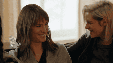 Gif of main characters laughing in The Happiest Season
