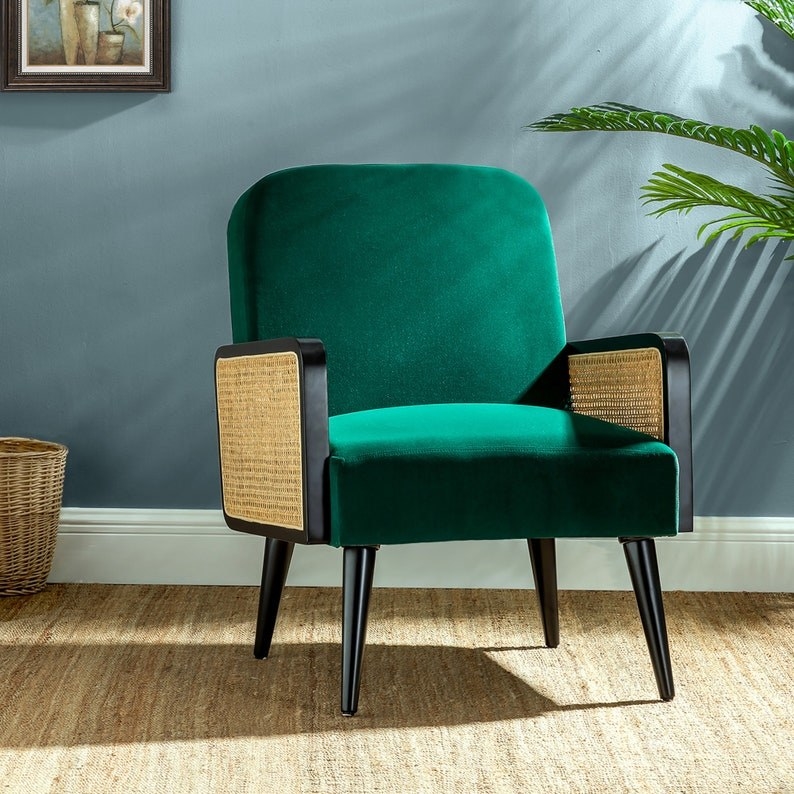 green chair with light brown wicker and black arms and black legs