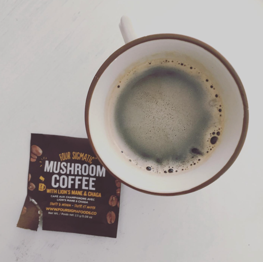 pack of coffee mix next to a reviewer's cup of coffee
