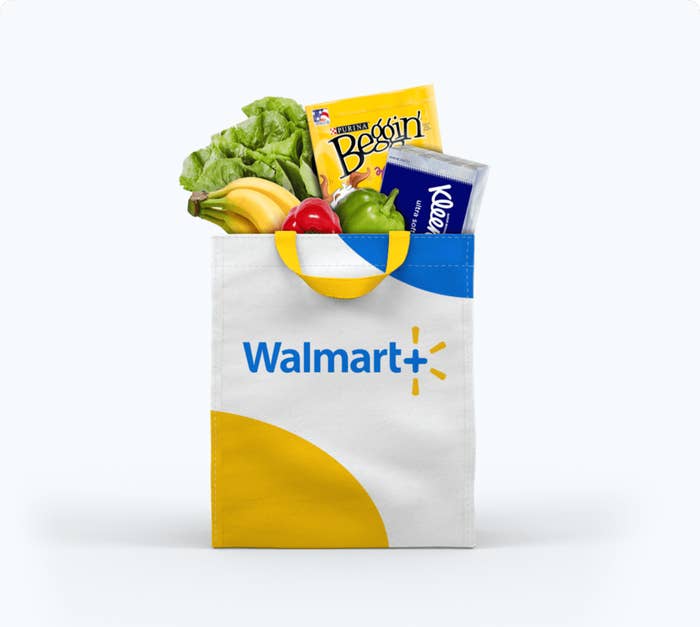 A Walmart tote with produce, dog treats, and Kleenex
