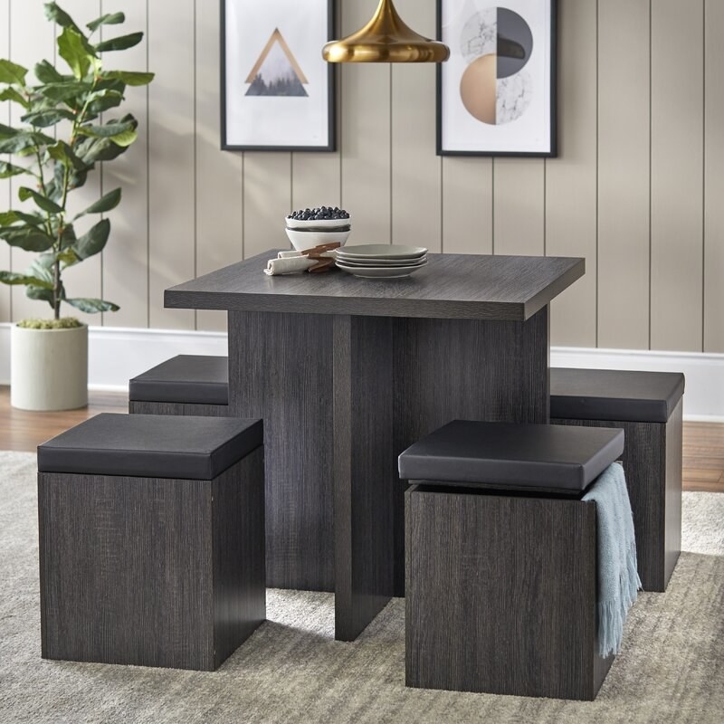 charcoal square table and square stools with removable cushions that open for storage