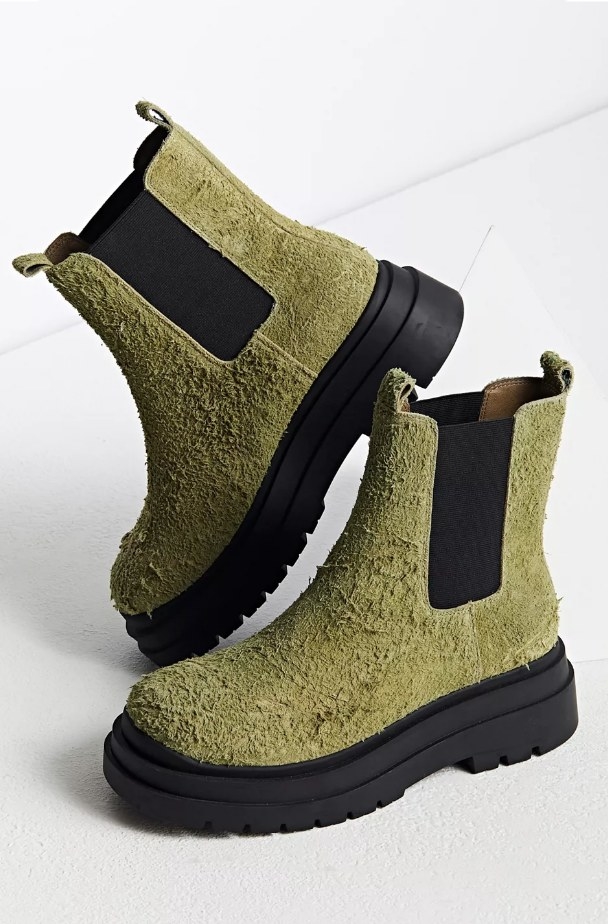 Textured suede green slip on boots with black sole