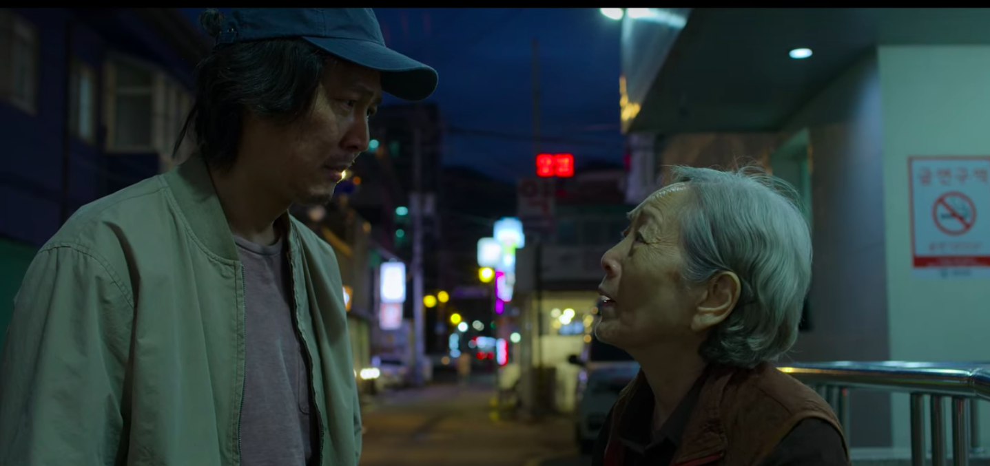 Man standing with his mother in the street