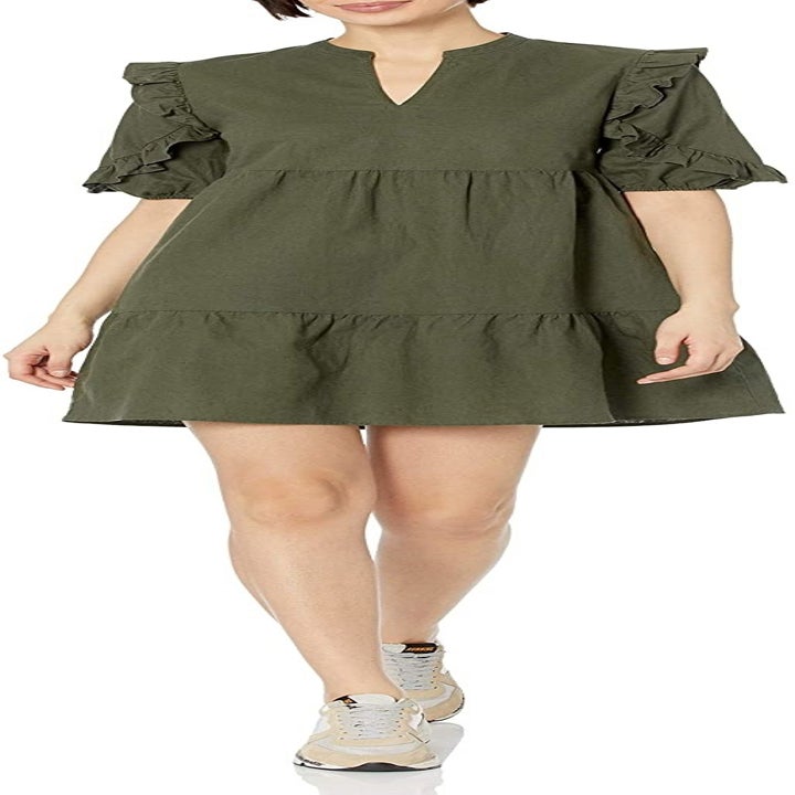 A model wearing the dress in green