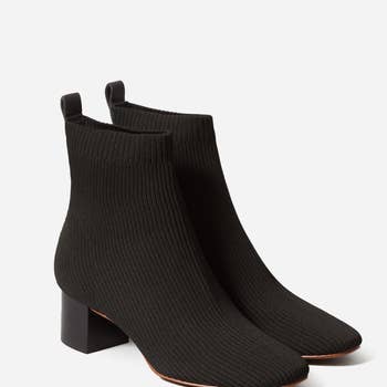 a pair of heeled knit booties in black