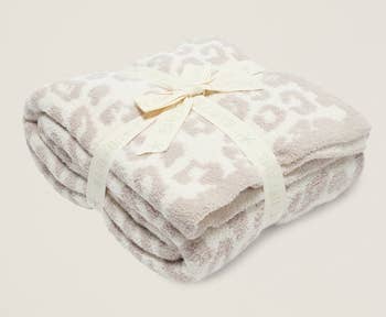 the cheetah-print blanket folded up with a bow