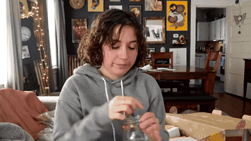 Gif of the writer stirring and sipping their iced coffee