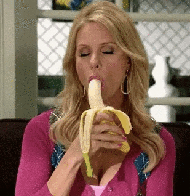 A woman eating a banana