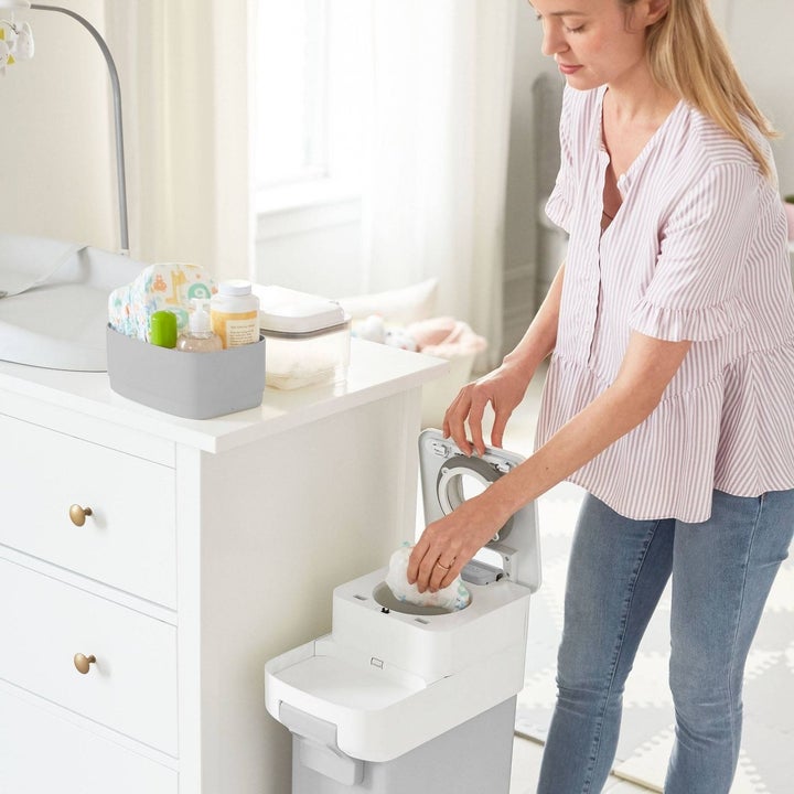 Mom disposing of diaper