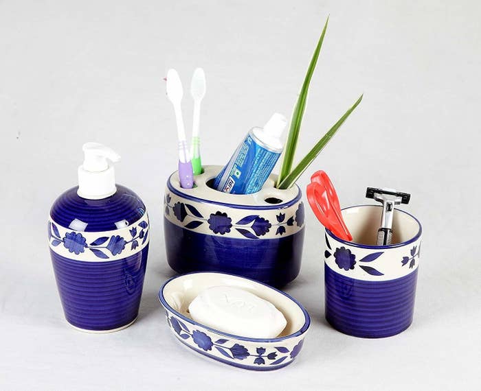 Blue and white bathroom organisers with toiletries in them