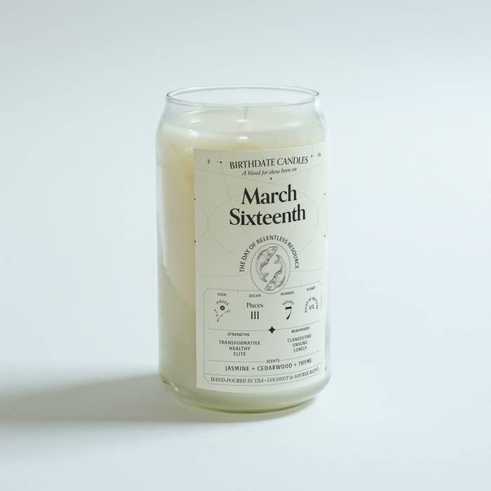 A hand-poured white candle in a jar with a label that says &quot;March Sixteenth&quot;