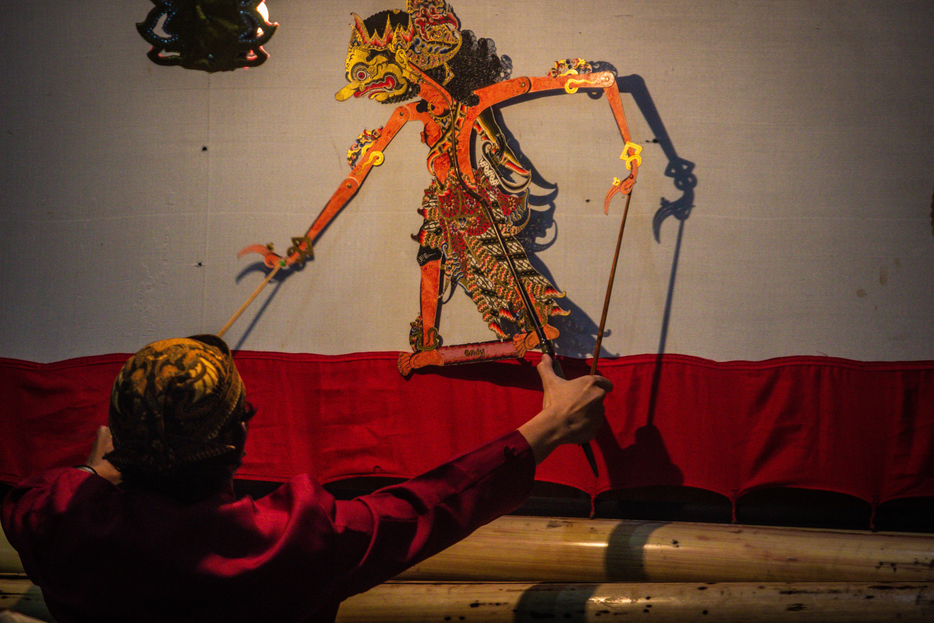A puppeteer handling a puppet.