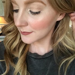 reviewer wearing the bronzer on their pale skin