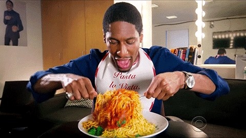 Man eating a giant plate of spaghetti