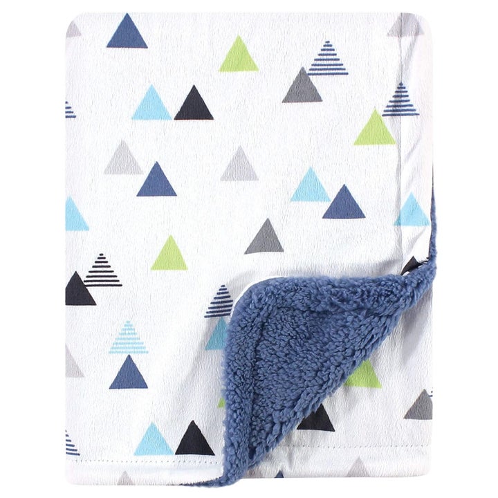 The white and blue sherpa blanket with colorful triangle designs