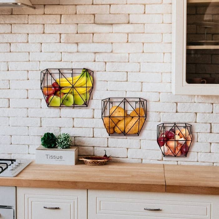 the fruit baskets on a brick wall