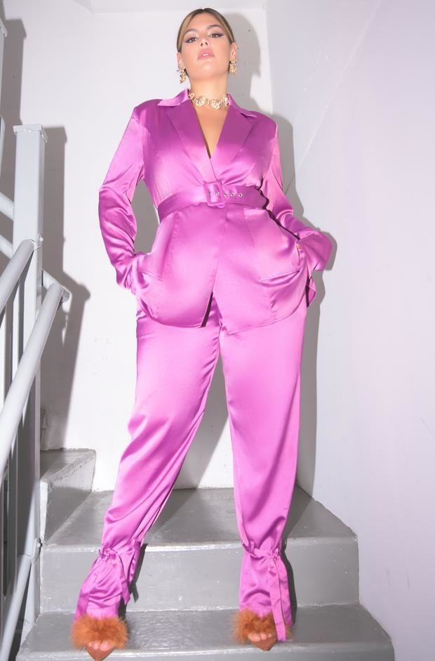 model wearing the blazer and matching paints in satin hot pink