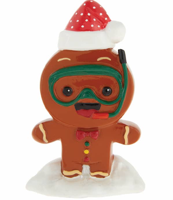 plastic gingerbread man figure dressed with a scuba mask and santa hat