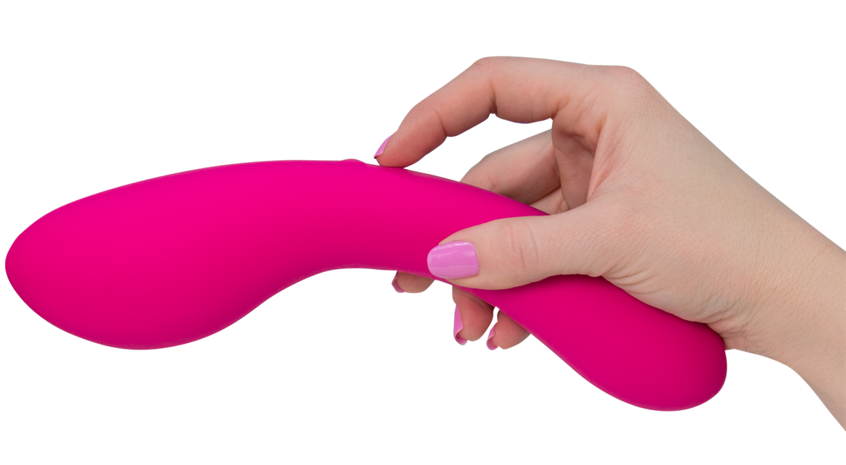 Model holding pink vibrator