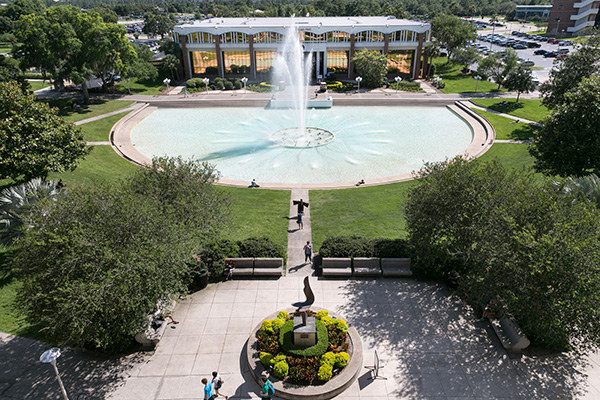 View of campus featuring the reflection pond and green space