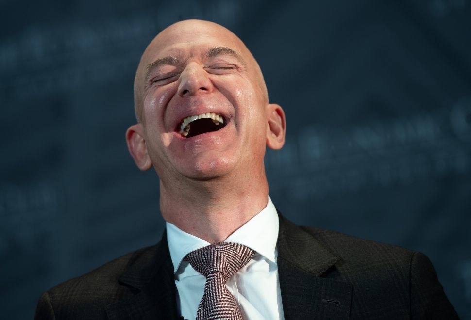 A photo of Jeff Bezos laughing