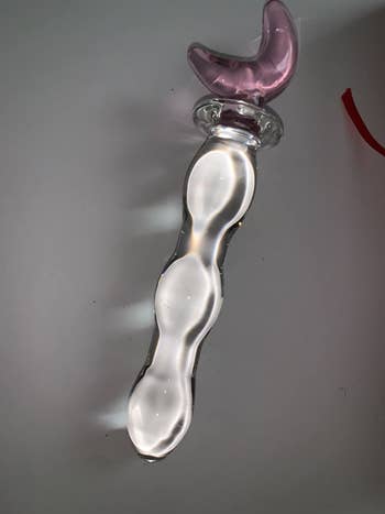 Glass dildo with pink moon-shaped base