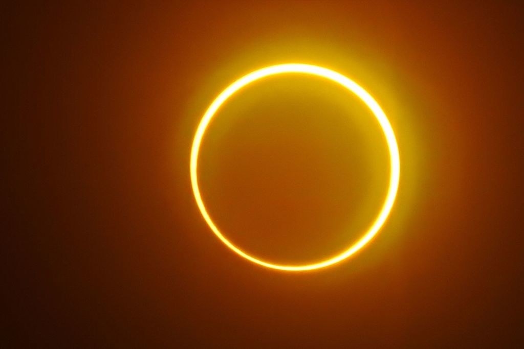 The sun and moon during a full eclipse