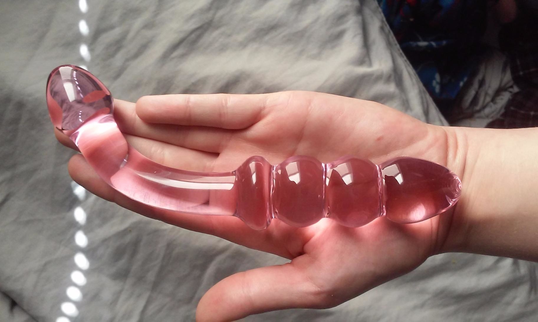 Reviewer holding pink dual-ended wand