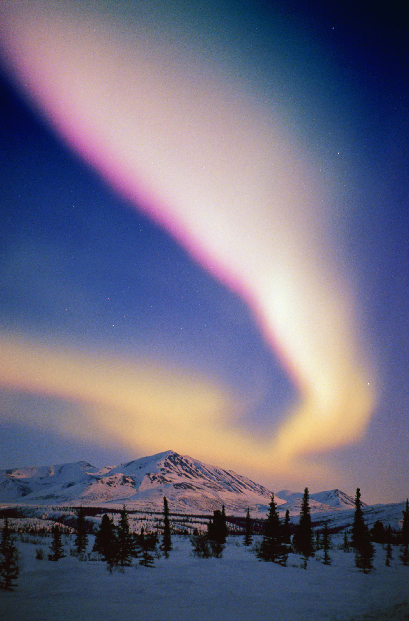 Aurora Borealis in the night sky in Alaska.