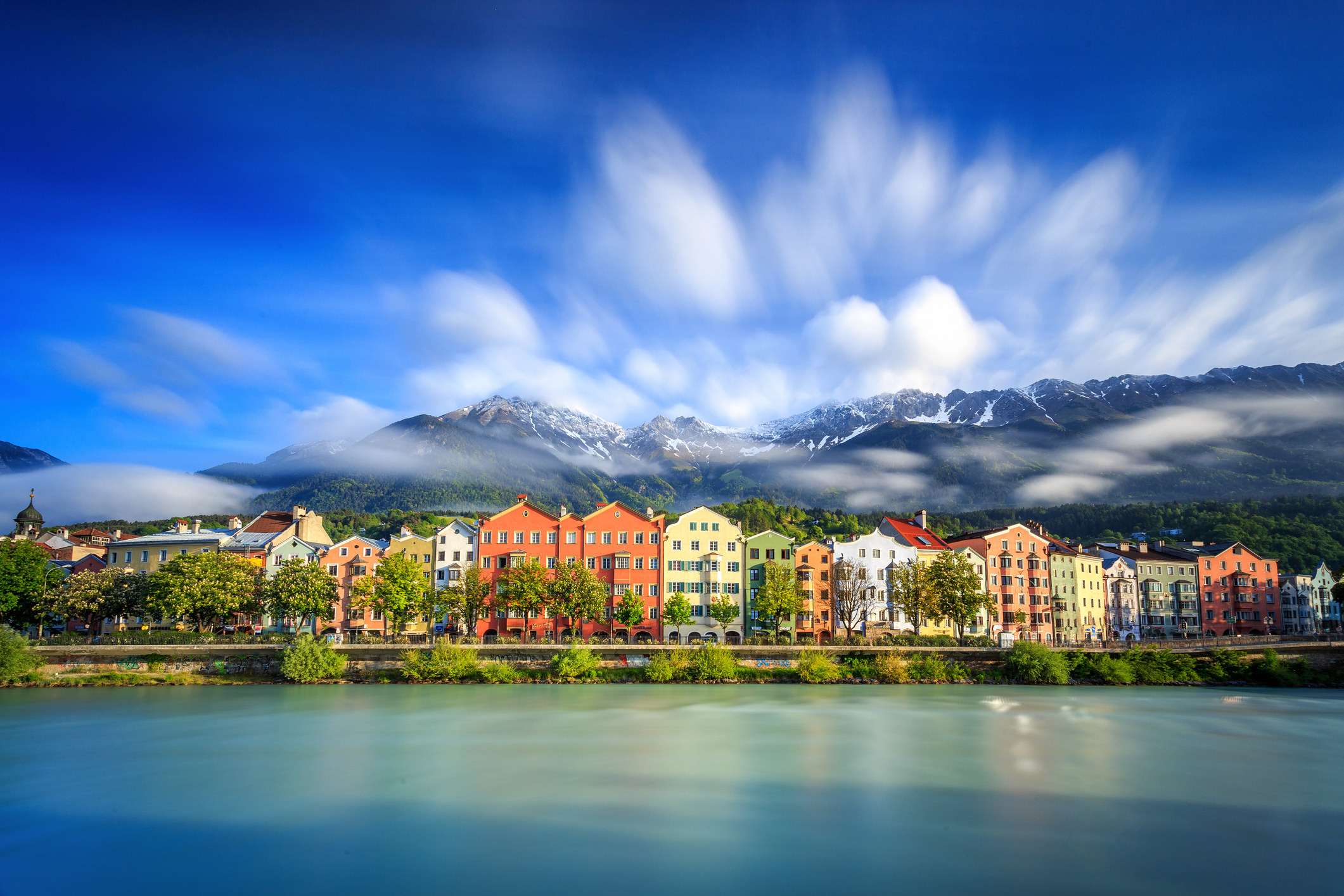 Colorful houses against the mountains in Innsbruck.