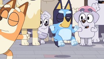 gif of the animated dog bluey dancing and pumping her fists in the air