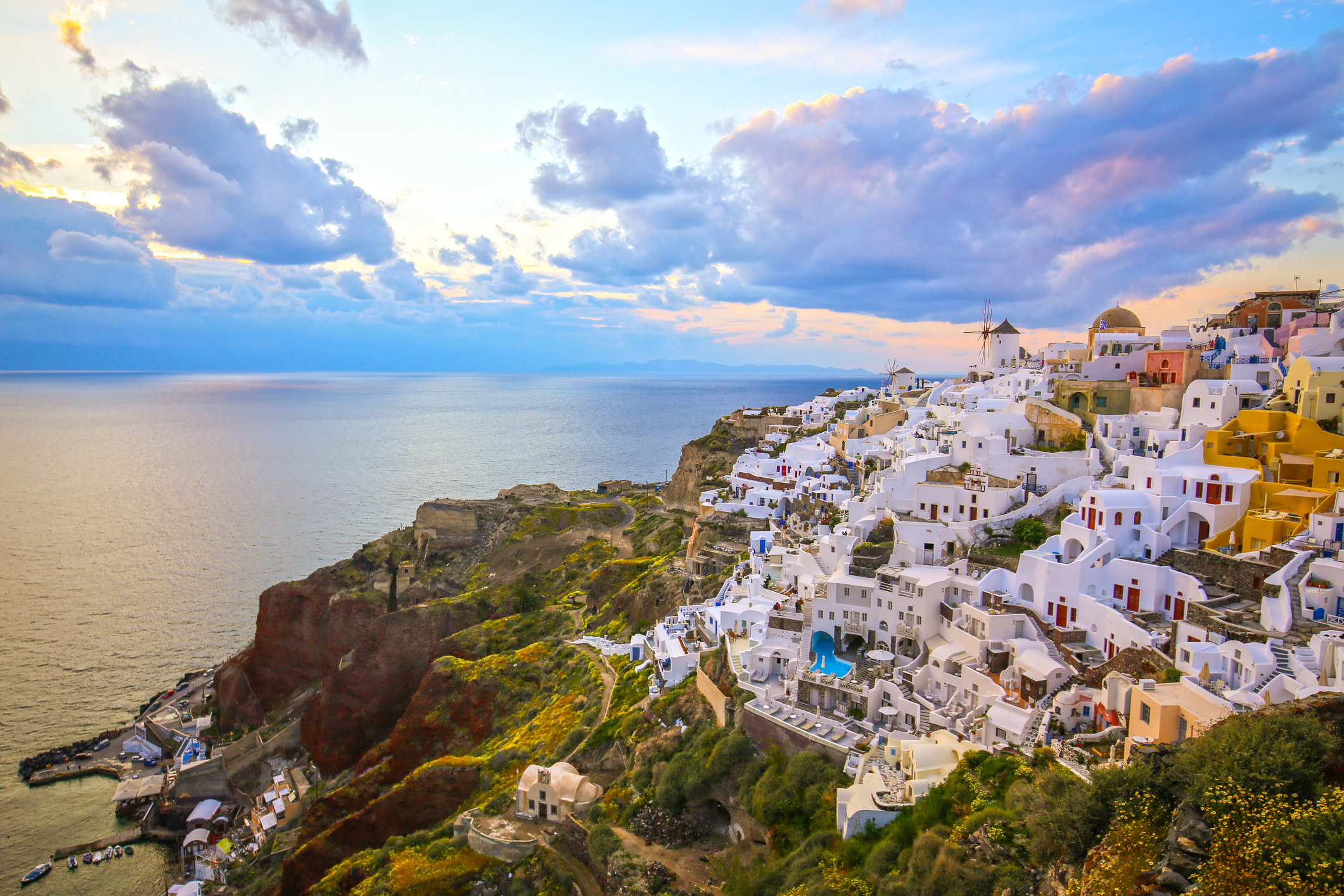 White buildings in a village overlooking the Aegean Sea.