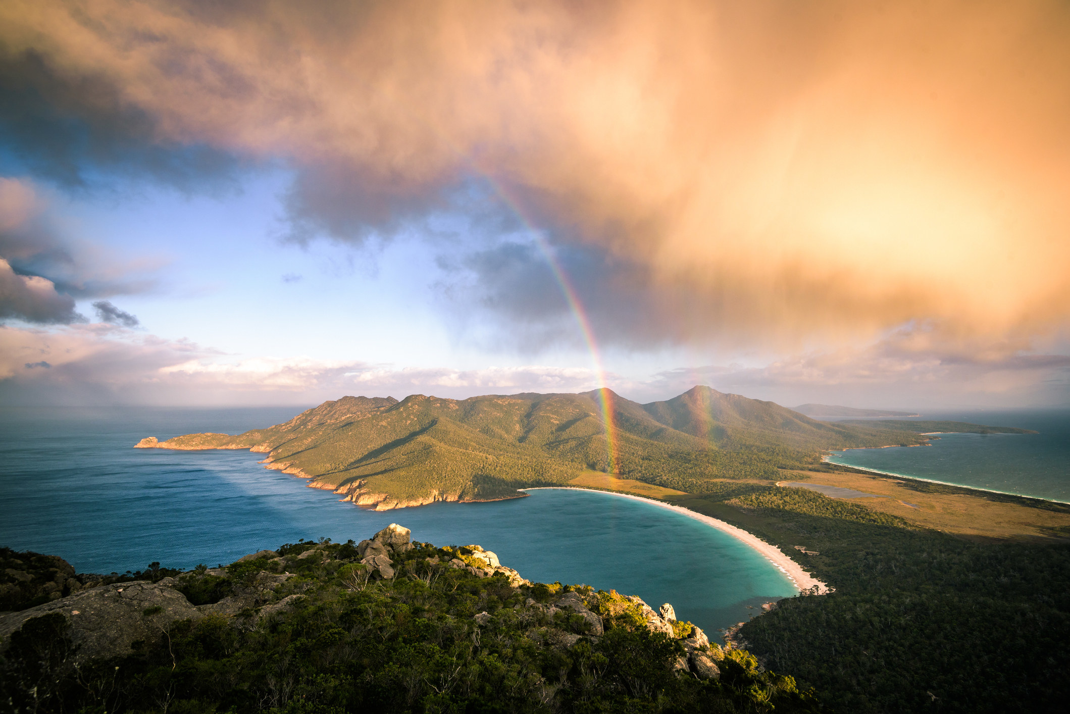 A storm cloud passing by mt Amos. View towards Wineglass Bay.
