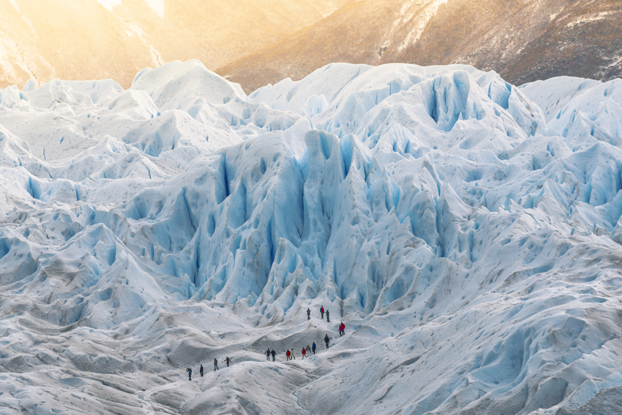 Group of people hiking on the Perito Moreno glacier.