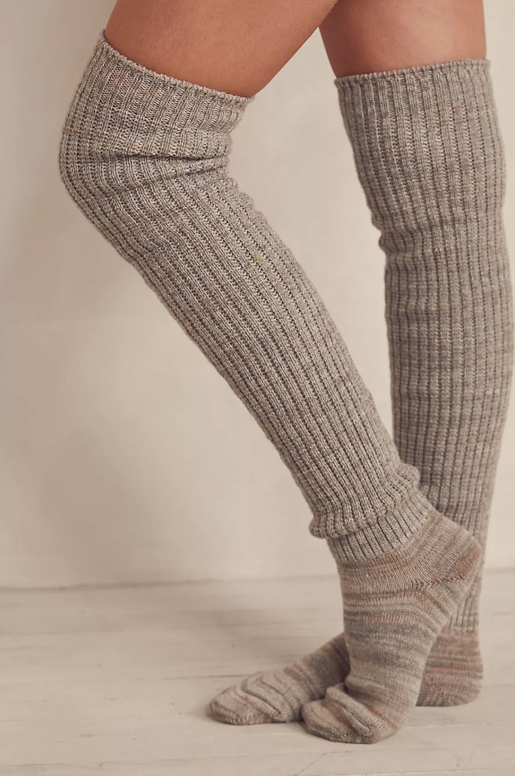 the tan knee high socks on a model&#x27;s legs right above the knee