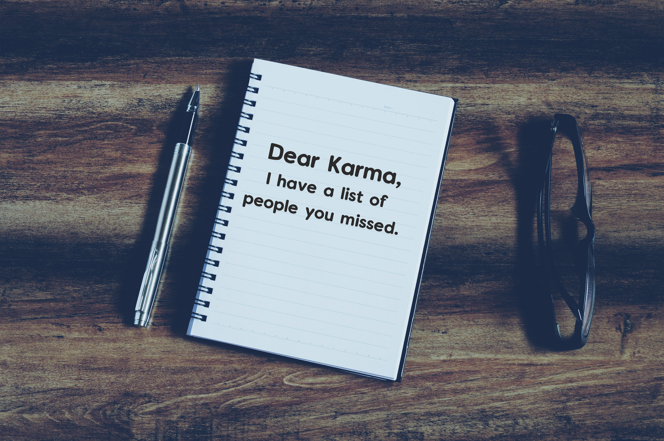 phrase &quot;dear Karma, i have a list of people you missed&quot; on notepad with vintage background