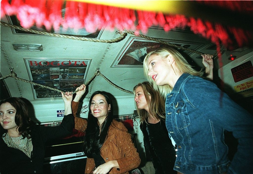 Cameron Diaz, right, Drew Barrymore, left, and Lucy Lou, center, get on the bus from &quot;Romancing the Stone&quot; to travel to the premiere of their movie &quot;Charlies Angels&quot;