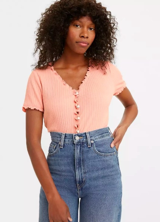Model wearing the pink ribbed v-neck top
