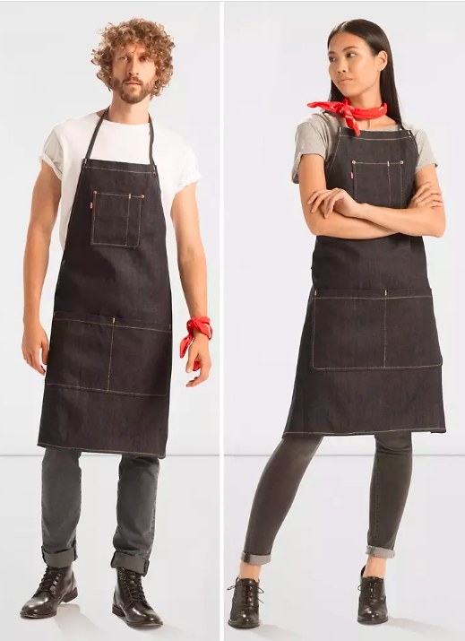 Models wearing the dark denim apron with three front pockets