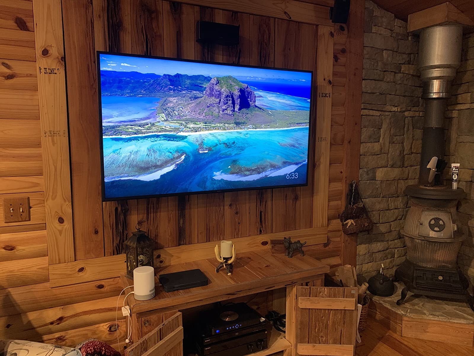 Reviewer photo of the TV mounted on a wall
